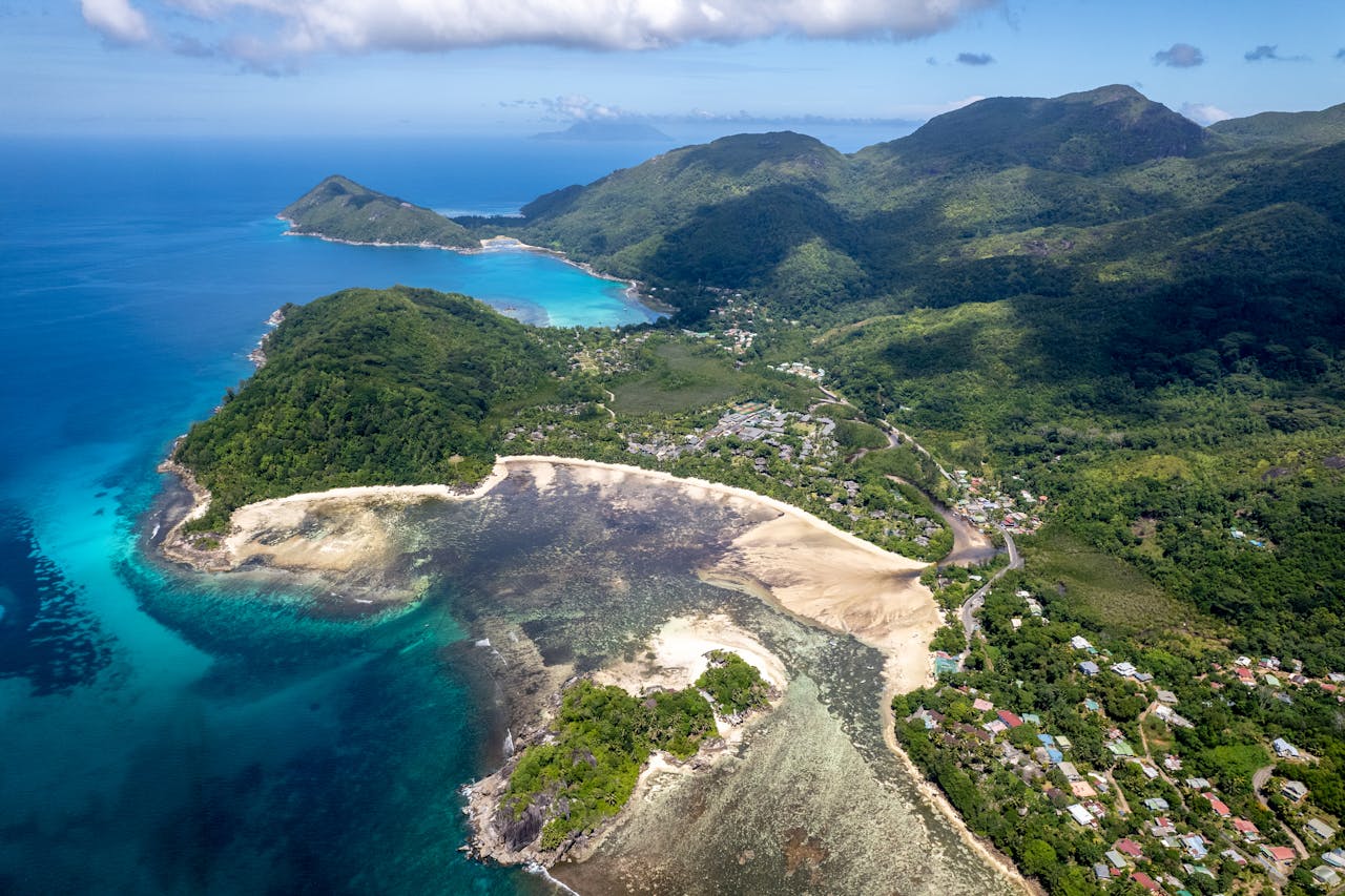 A breathtaking aerial view of Mahe Island's pristine coastline and lush landscapes in Seychelles.